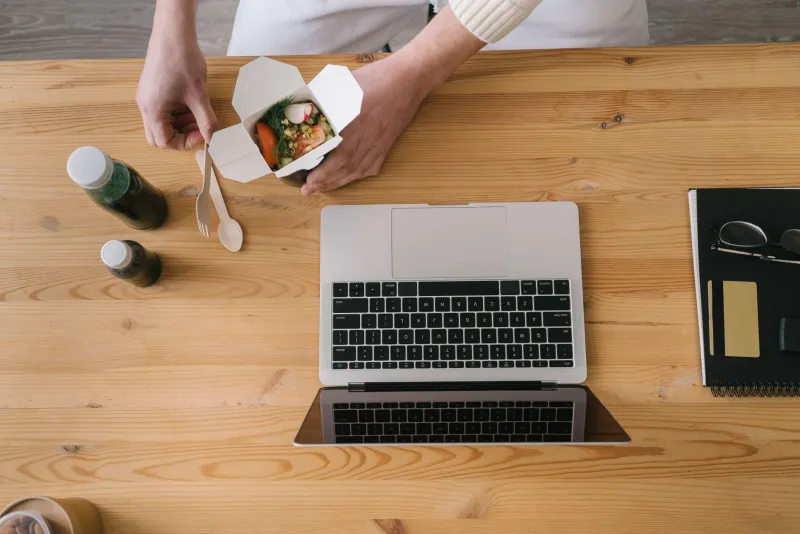 Eating at Your Desk While Working Is Costing You More Than You Realize
